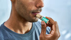 Dr. Squatch Coconut Cove Lip Balm being used